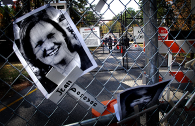 The fence with a photo of murdered religious worker Jean Donovan